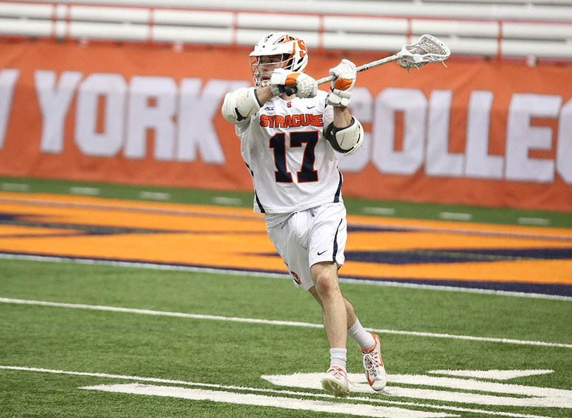 Dylan Donahue lifts his stick up while running the Orange offense. He had two goals against the Bearcats and continued playing well as the quarterback of the team.