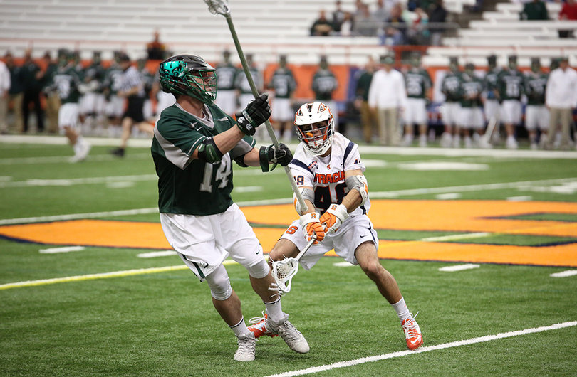 Sergio Salcido (48) attempts to disrupt a Binghamton player with the ball.