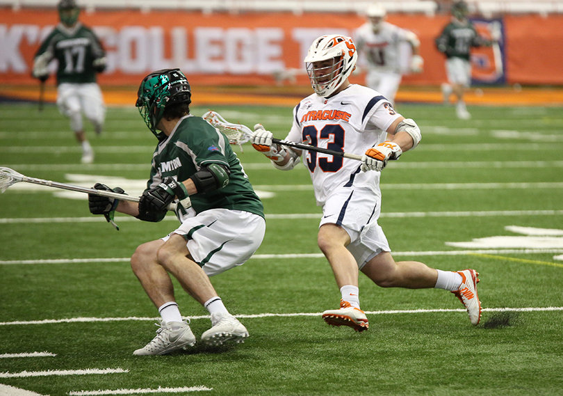 SU defender Ralph D'Agostino tracks down a Bearcats offensive player.