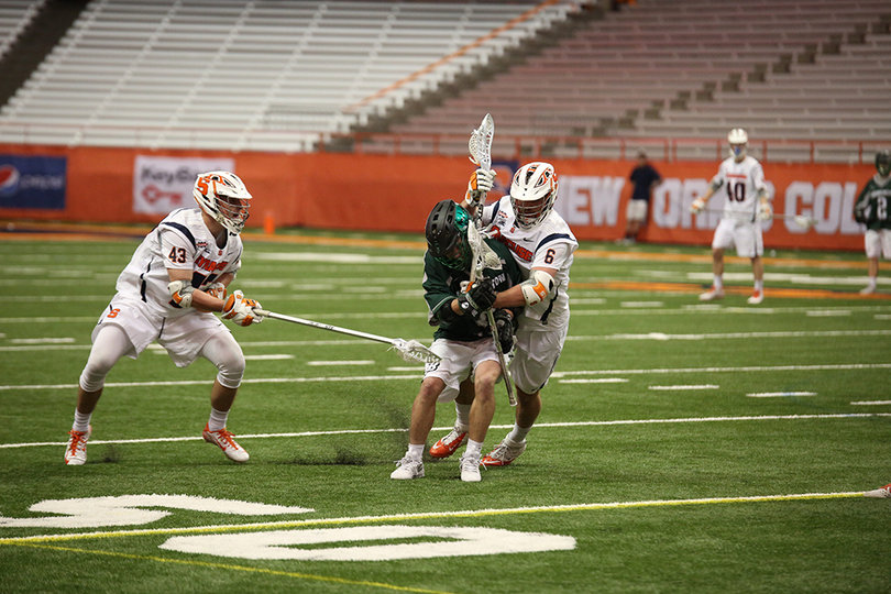 Luke Schwasnick (6) and Marcus Cunningham (43) look to snatch the ball away. Schwasnick picked up three ground balls in the win.