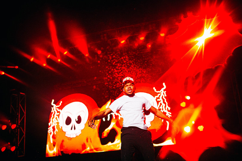 Chance The Rapper showers the pit and first few rows with water.