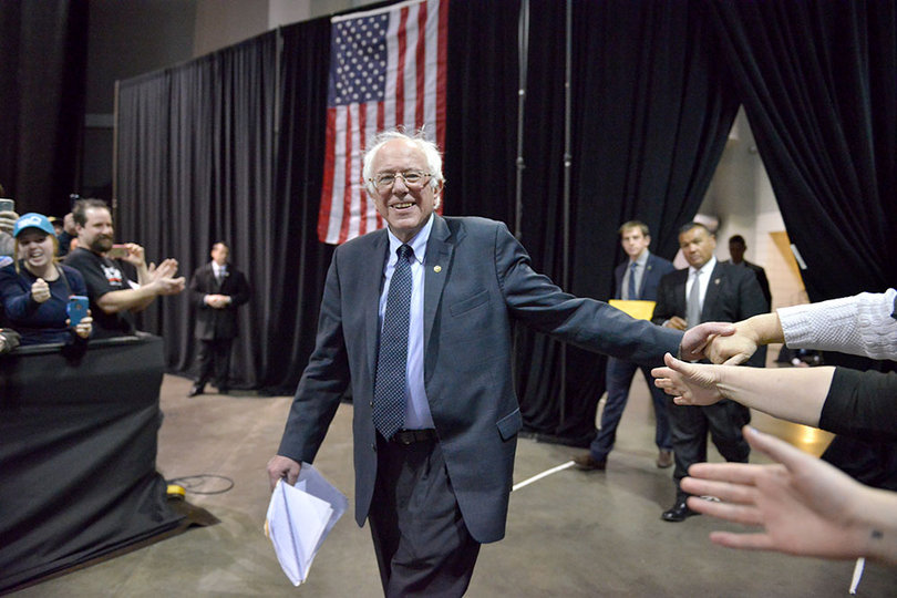 Sanders high fives supporters Tuesday. He spoke for more than one hour and 15 minutes.