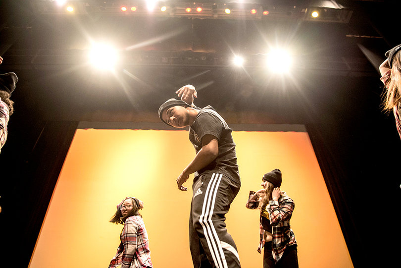 One of the male dancers involved in the Orange Pulse Dance Troupe performs with the beginning and intermediate class in Hip-hop.
