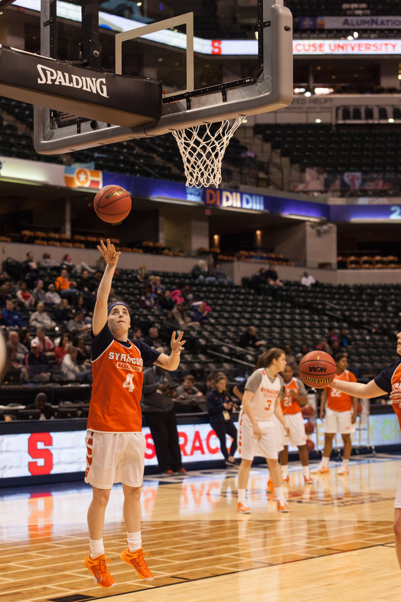 Maggie Morrison takes a layup during one of SU's drills. The Orange plays Washington at 8:30 p.m. on Sunday in the Final Four.