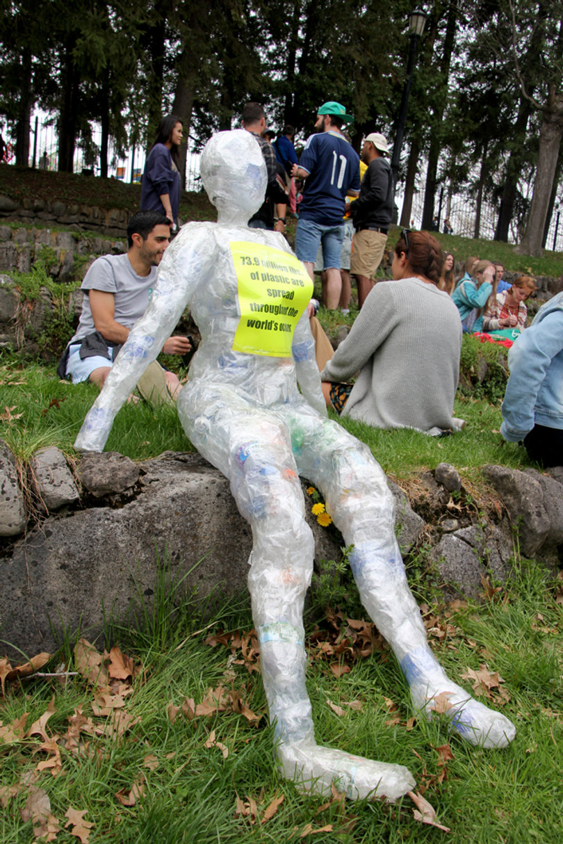 A statue made of plastic water bottles and plastic wrap sits at Earthfest to represent the amount of plastic that goes un-recycled every day.