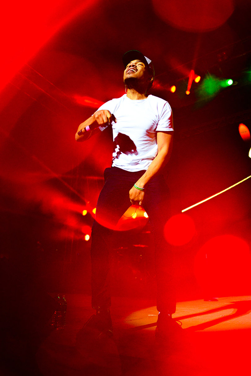 Chance The Rapper listens to the audience's cheers over his own beats.