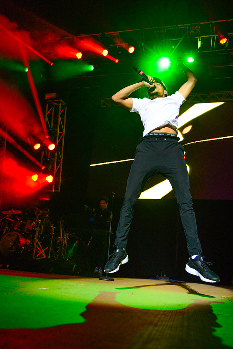 Chance The Rapper's high-energy antics get the crowd pumped.