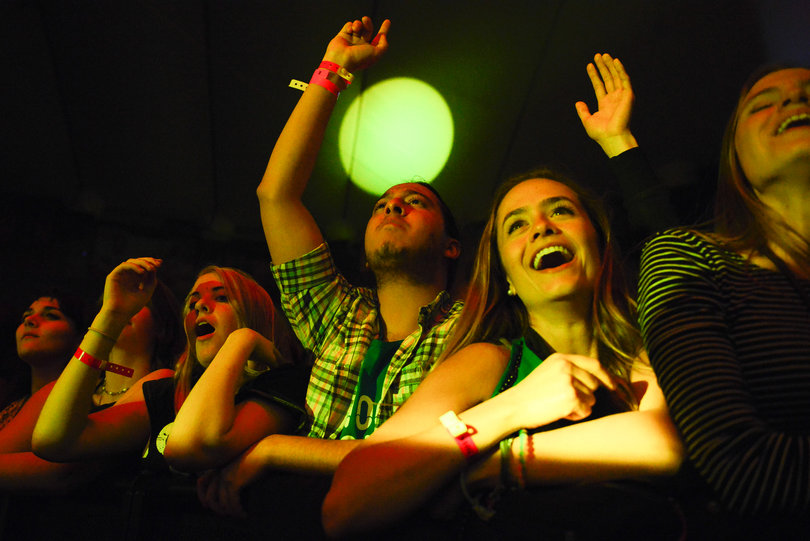 The audience sings and bounces to the beat of The Chainsmokers' hits.