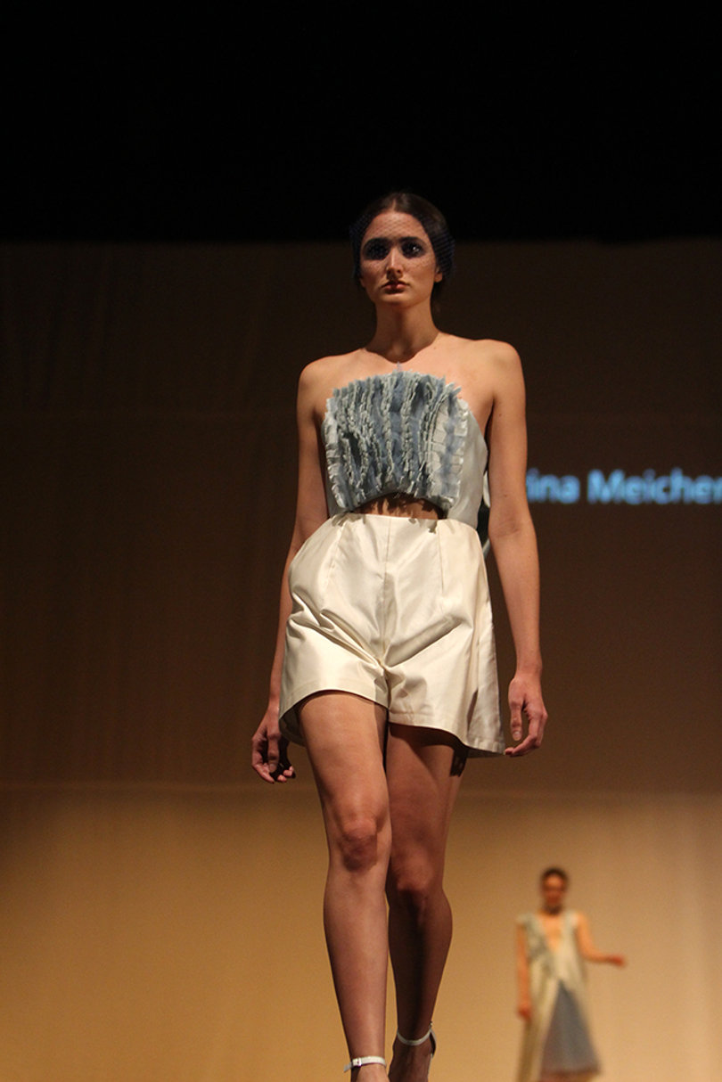 A model walks out in a ruffled romper by designer Katrina Meicheng.