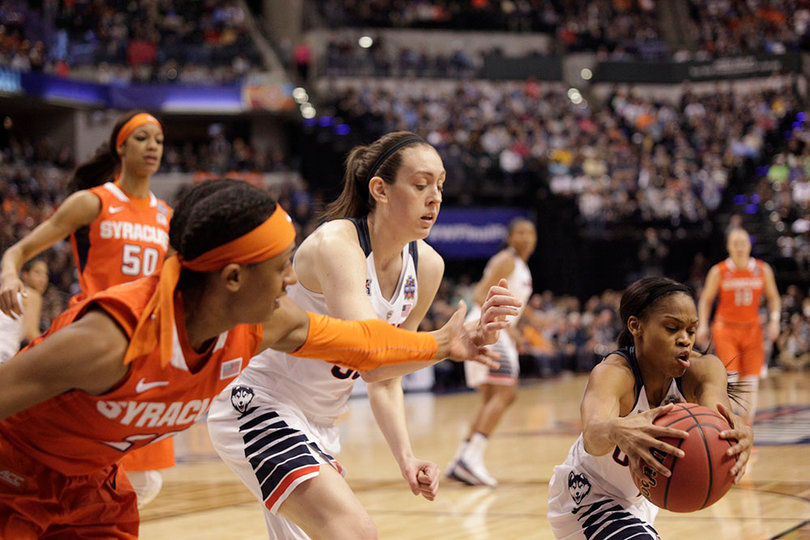 Moriah Jefferson (right), Connecticut's all-time leader in assists, snatches the ball away.