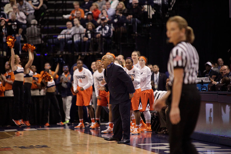The Syracuse bench, led by coach Quentin Hillsman, celebrates during the Orange's 14-0 run in the third quarter.