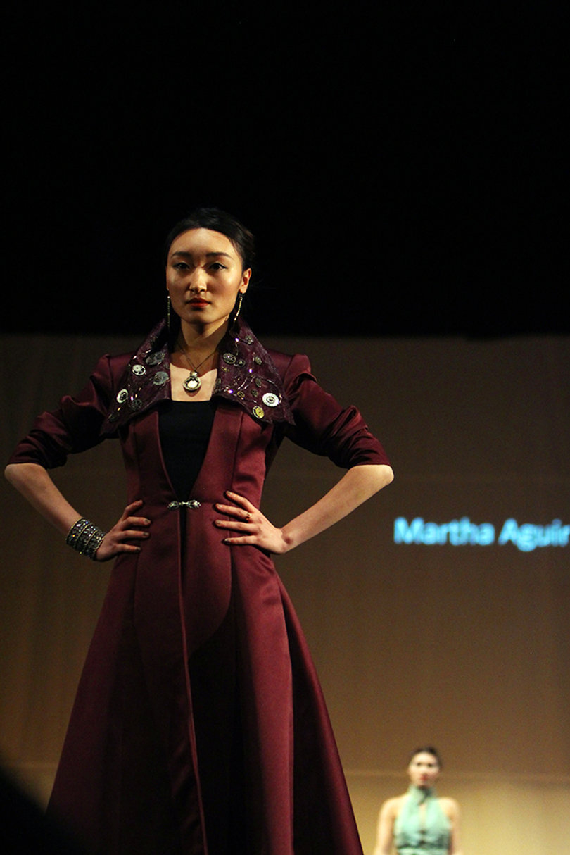 Designed by Martha Aguirre, this model's basic dress grabs attention with a bold collar.