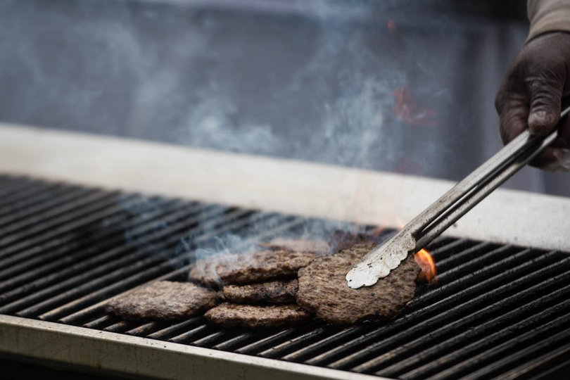 SU Food Services employees continuously grill and make food to meet student demands.