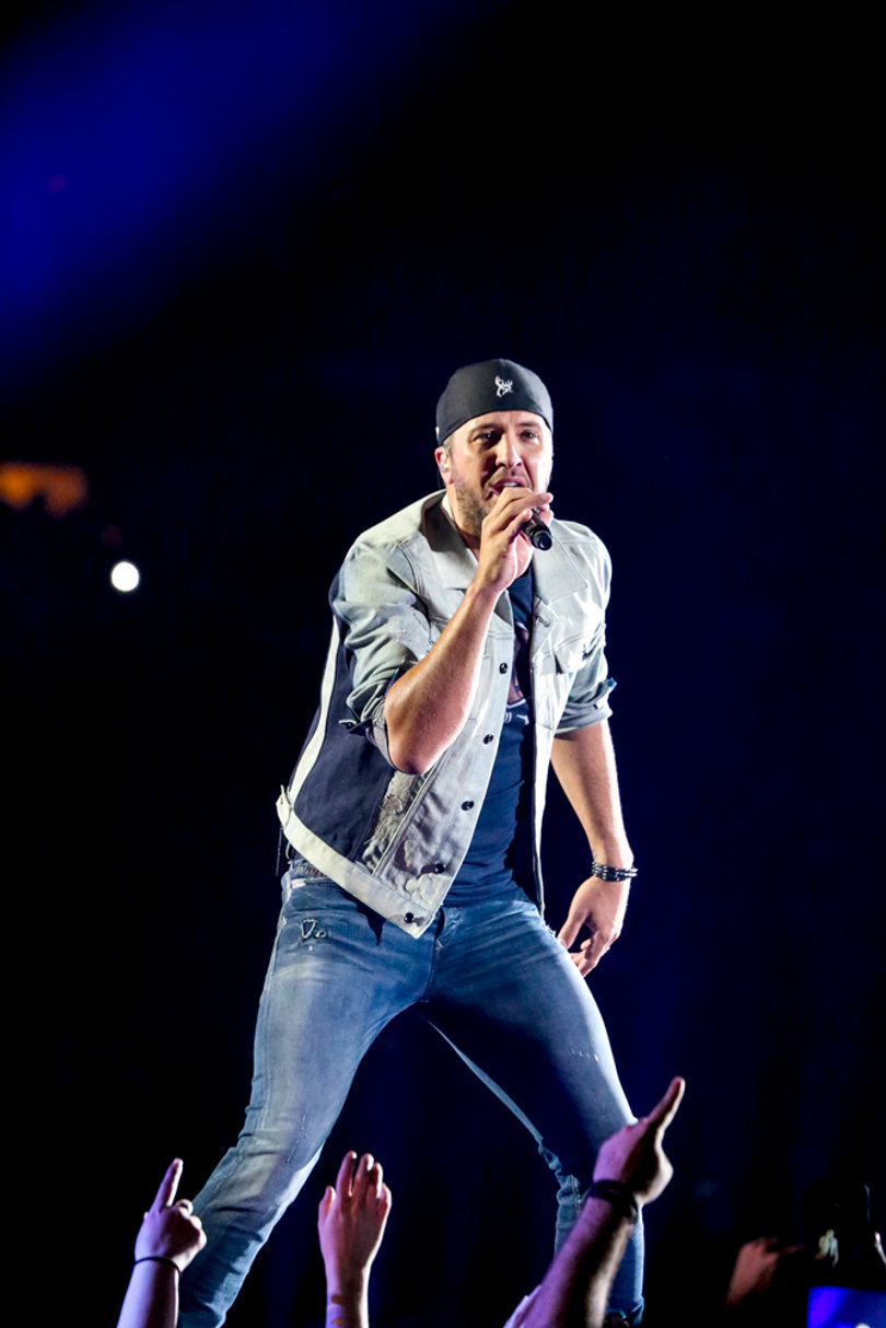Fans tossed their arms in the air and bounced to the beat of Bryan's country jams.