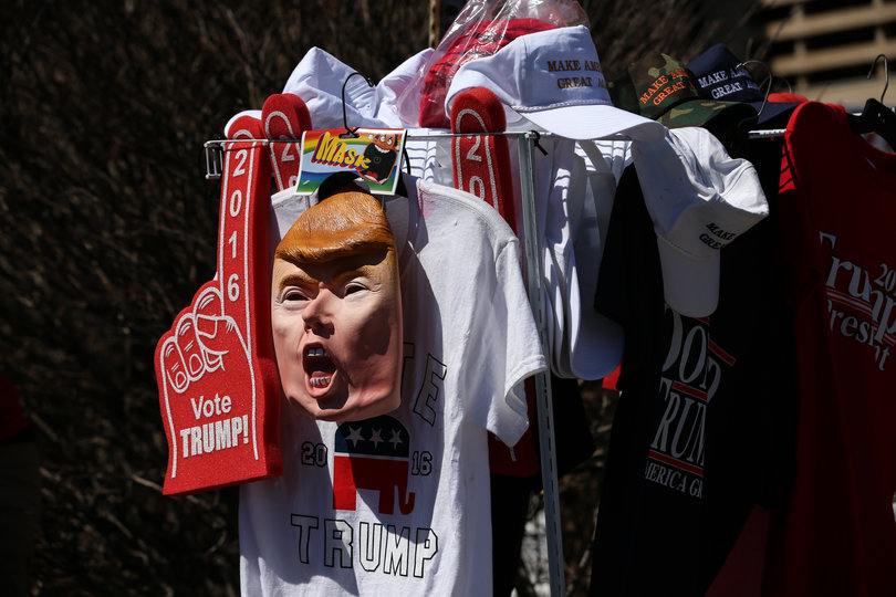Outside the OnCenter, attendees had the opportunity to purchase Trump merchandise, such as this foam finger and mask. Many rally-goers wore Trump apparel.