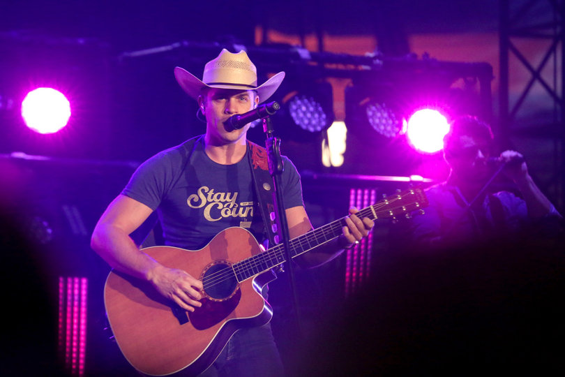 Dustin Lynch opened up the three-act show while audience members were still finding their way to their seats.