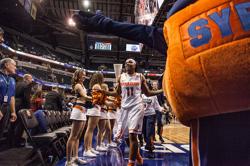 Fondren high fives the SU cheerleaders before heading into the locker room after defeating Washington in the national semifinal. 