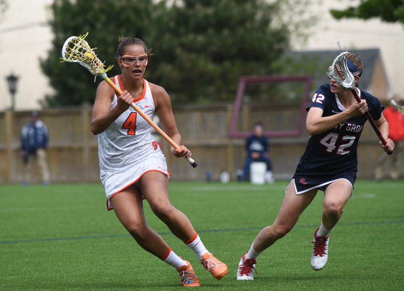 Erica Bodt cuts through the defense while cradling the ball. She scored one of the Orange's seven goals. 