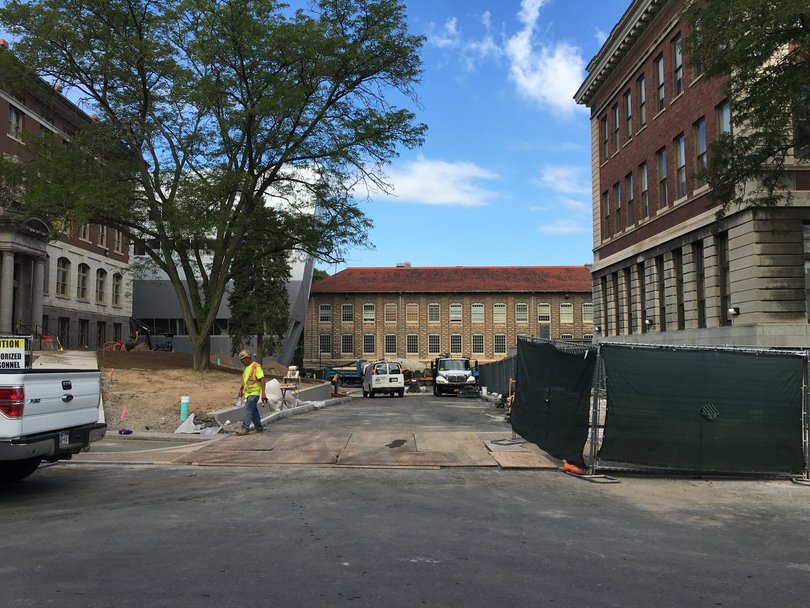 Some of the fencing around Slocum Hall has been taken down after paving was completed, but the construction project is not yet complete. Photo taken July 22, 2016