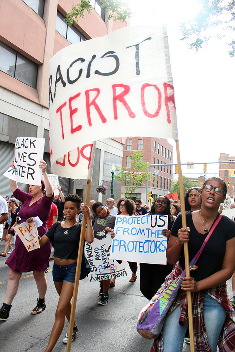 One sign held by a protester during the Black Lives Matter march reads: "Protest us from the protectors."