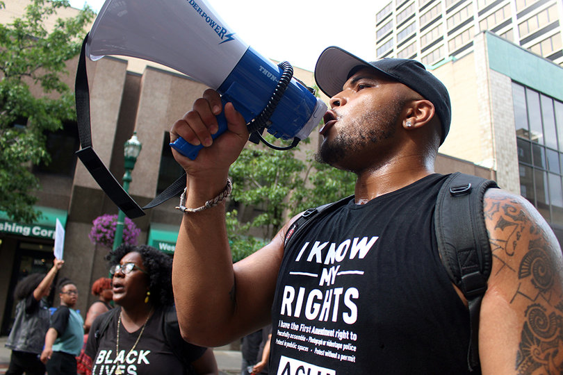 Organizers led the entire crowd in united chants of "Hey hey ho ho these racist cops have got to go!"