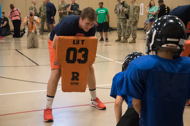 O'Sullivan smiles as a player lines up at the start of a drill.