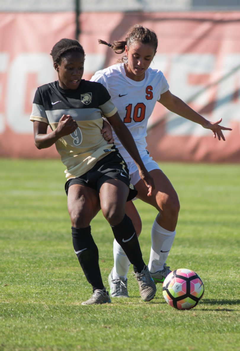 Syracuse defender Jessica Vigna battles for a ball with Army's Jade Jamison. Vigna and the Orange defense posted its second shut out in a row.