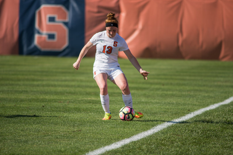 Defender Maddie Iozzi passes the ball along the sideline. She led the Orange with two shots — one on goal. 