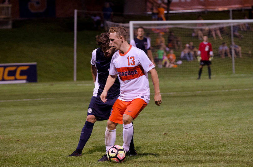 Jan Breitenmoser shields the ball from a Loyola Marymount defender. Breitenmoser took a shot on goal.