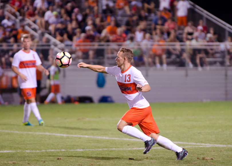 Breitenmoser lunges foward as the ball flies through the air.