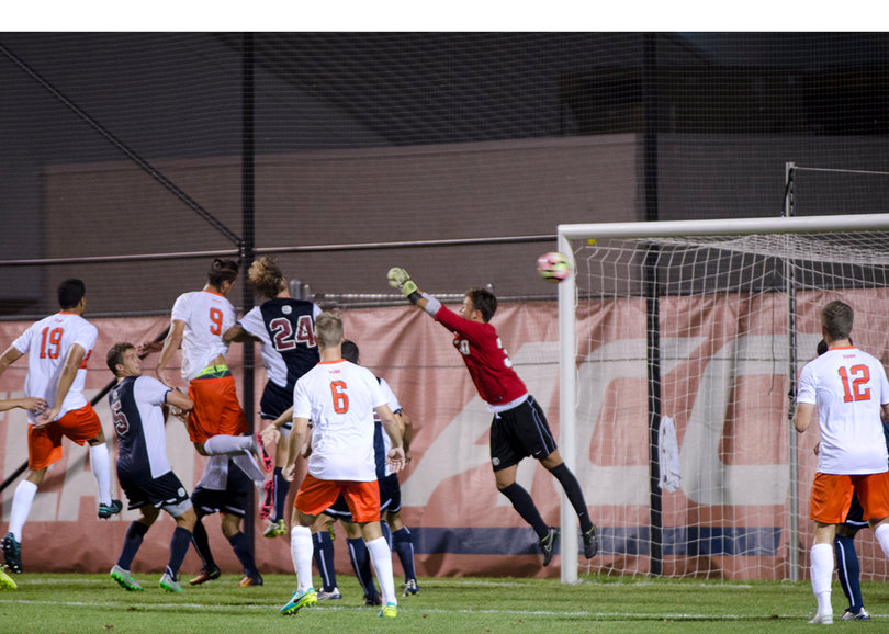 Johannes Pieles (9) scores the game-winning goal in overtime on Sunday night. He scored both of Syracuse's goals in the 2-1 win.