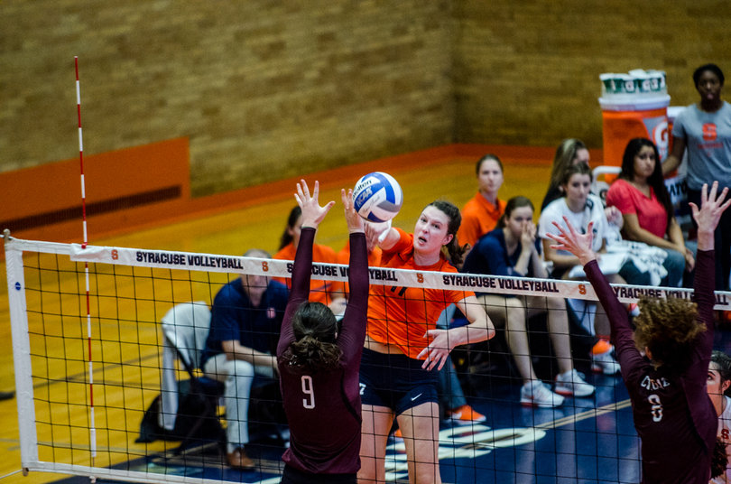 Orange outside hitter Mackenzie
Weaver tries to spike a ball past Colgate's Kathleen Harris. Syracuse couldn't get the points it needed at the end of sets.
