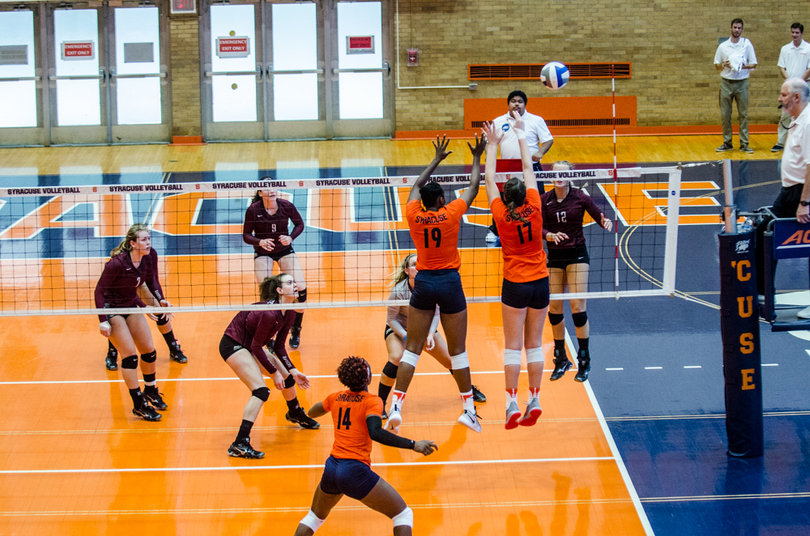 Santita Ebangwese and Mackenzie Weaver jump up for the block. The Orange had 13 blocks in the game.