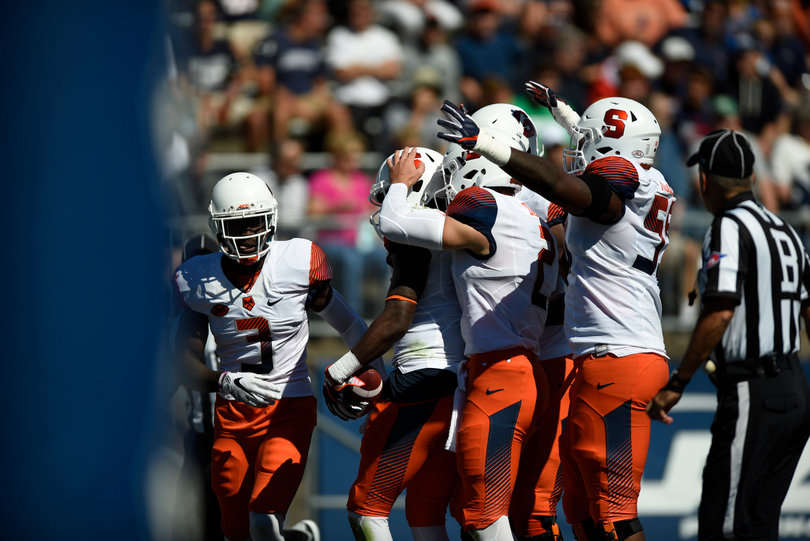 Syracuse teammates celebrate against Connecticut on Saturday.