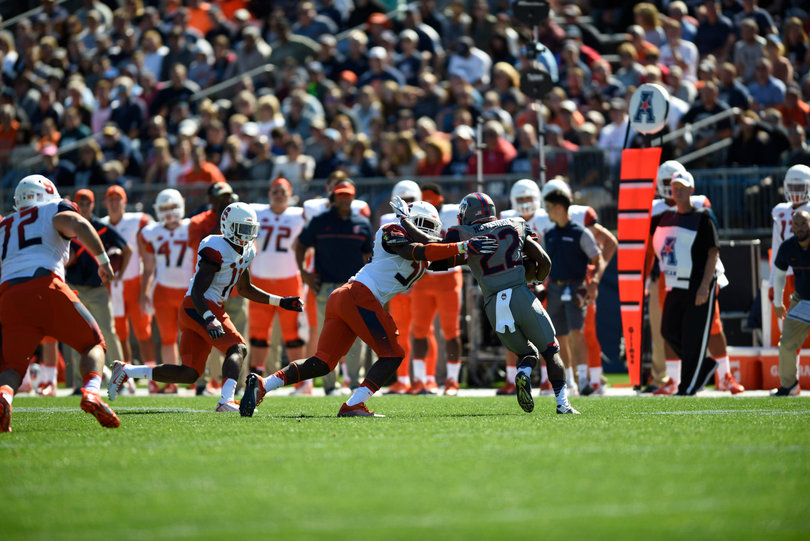 Newsome looks to turn the corner against an Orange defender.