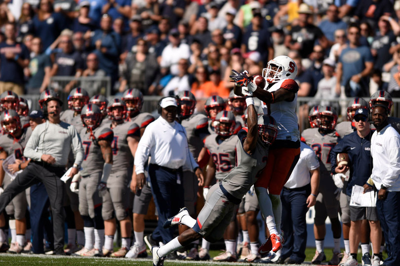 Etta-Tawo rises up for a catch over a Huskies defender.