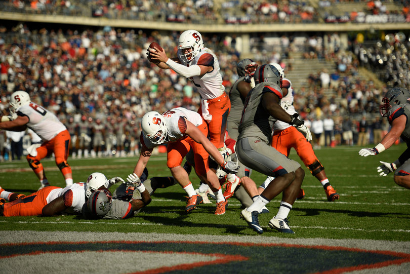 Dungey leaps for the end zone. He ran for one touchdown and threw for two more. 