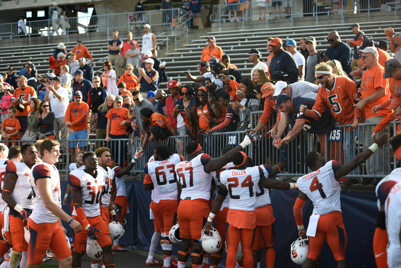 Syracuse fans high five players on Saturday afternoon.