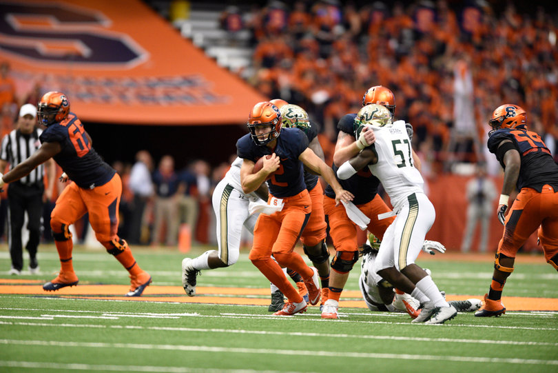 Dungey busts through the line of scrimmage while keeping his eyes upfield.
