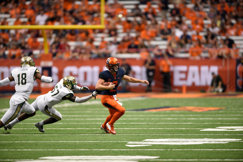 Dungey escapes two USF defenders. He ran for 18 yards on 12 carries.