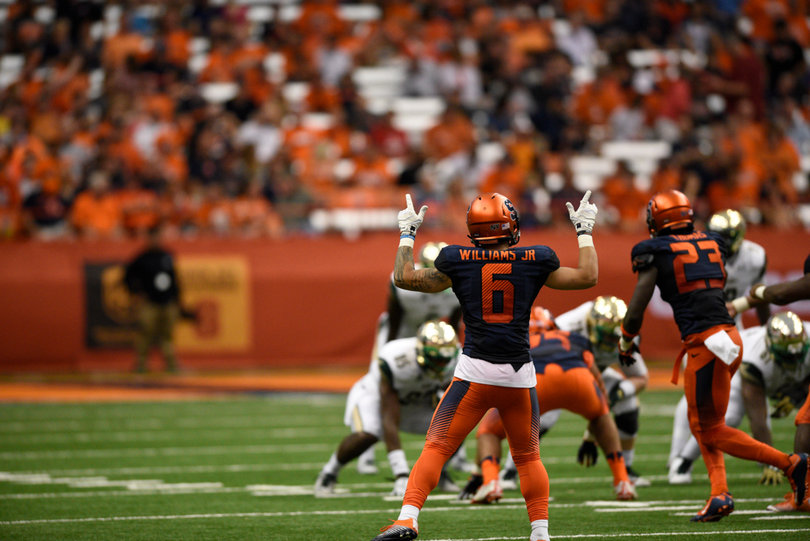 Williams gives hand signals to the rest of the Orange's defense.
