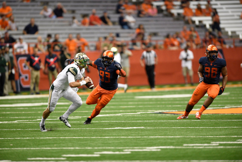 Defensive lineman De'Jon Wilson (93) and McKinley Williams (98) chase down backup Bulls quarterback Brett Kean.