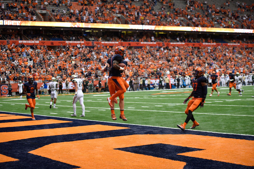 Syracuse players celebrate in the end zone. Unfortunately for the Orange, it only scored two touchdowns on the day.