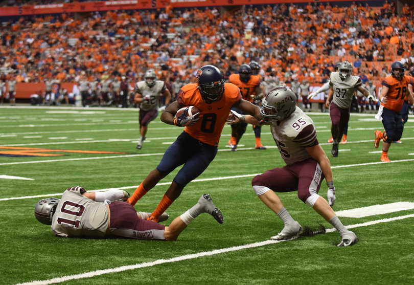 Wide receiver Steve Ishmael stiffs arm a Colgate defender. He finished with six catches for 36 yards. 