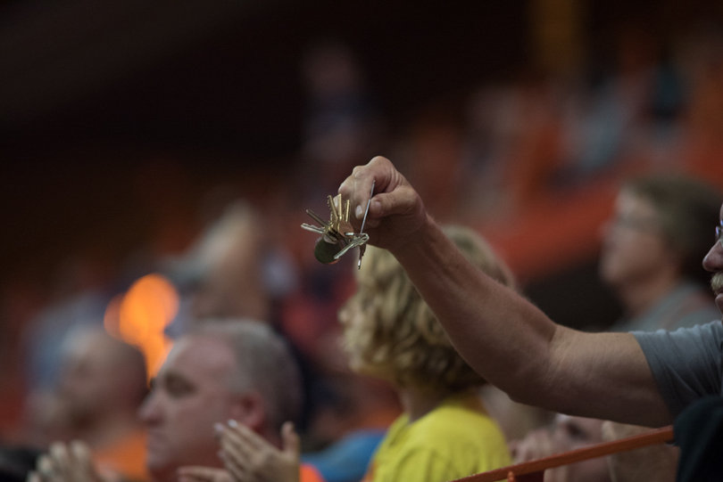 Fans take out their keys to jingle during the "key play" third down tradition. 