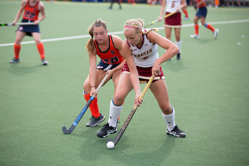 Gillingham fights for possession with an Eagle player.