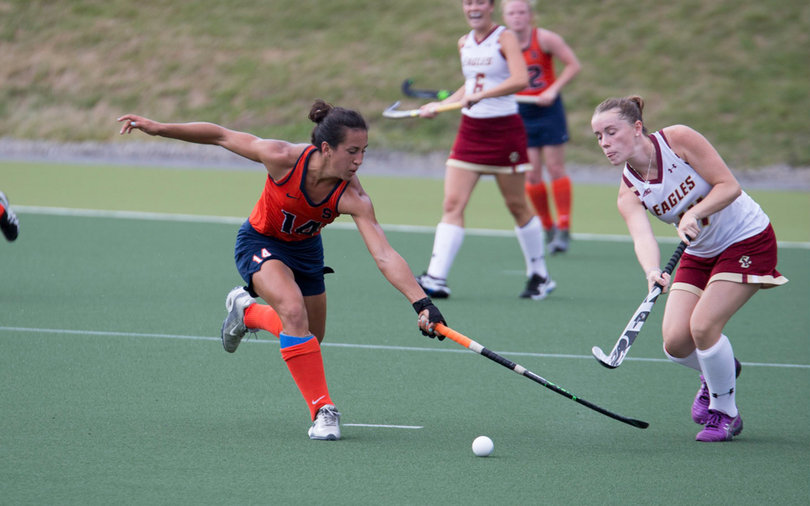 Hurff uses one hand to stretch out and try and win the ball. 