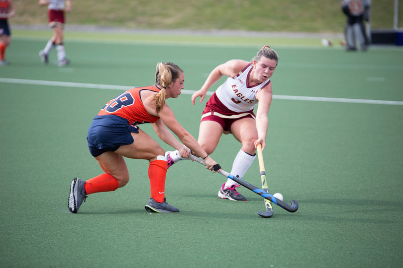 Erin Gillingham reaches her stick in to try and poke the ball away. 