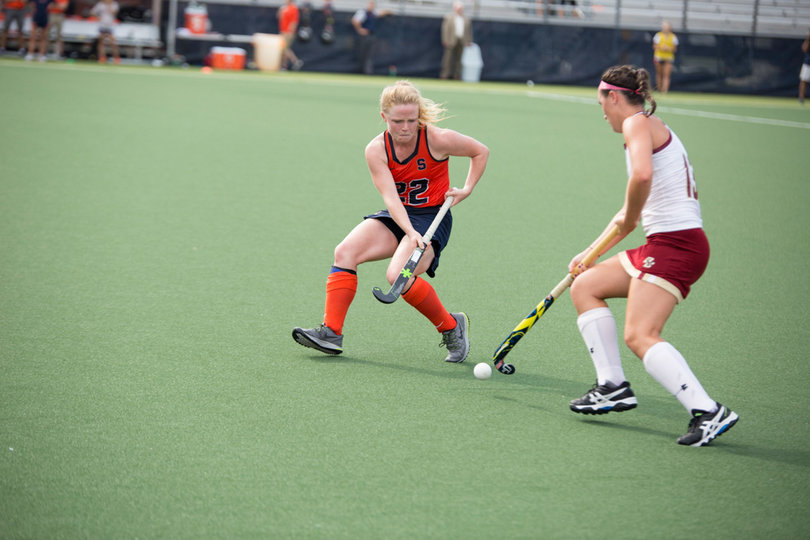 Elaine Carey fights for the ball with an Eagles player. 