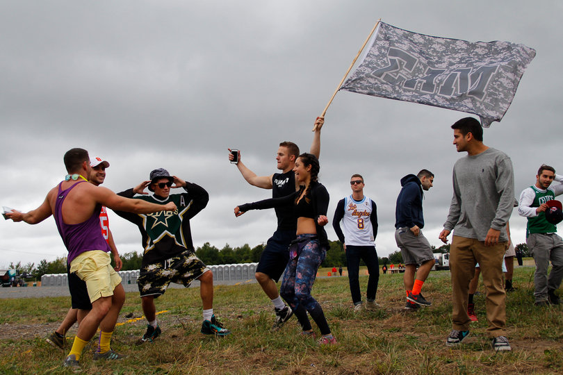 Juice Jam attendees gather and dance as the Juice Jam sets continued throughout the afternoon despite overcast skies. 